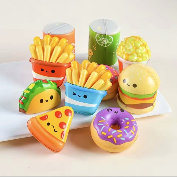A collection of smiling food-inspired mini squishies